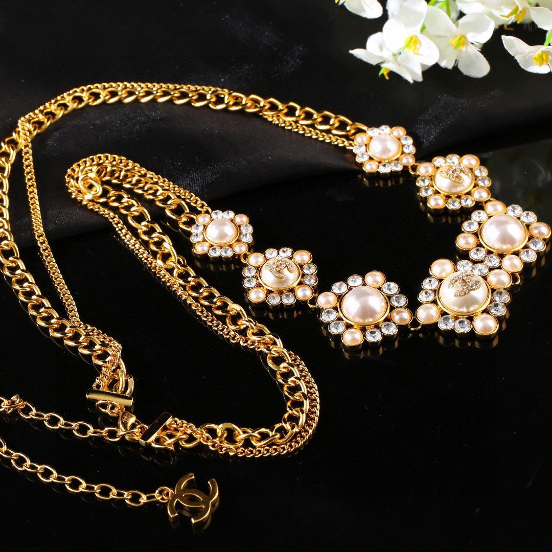 CHANEL 25S CHAIN BELT IN GOLD METALLIC WITH PEARL 614283