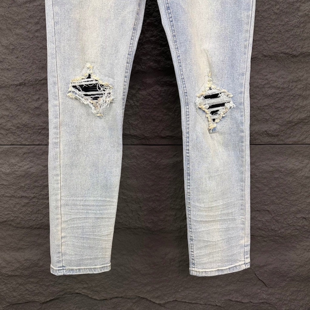 AMIRI Black Ribbed Patch Distressed Slim‑Fit Denim Jeans